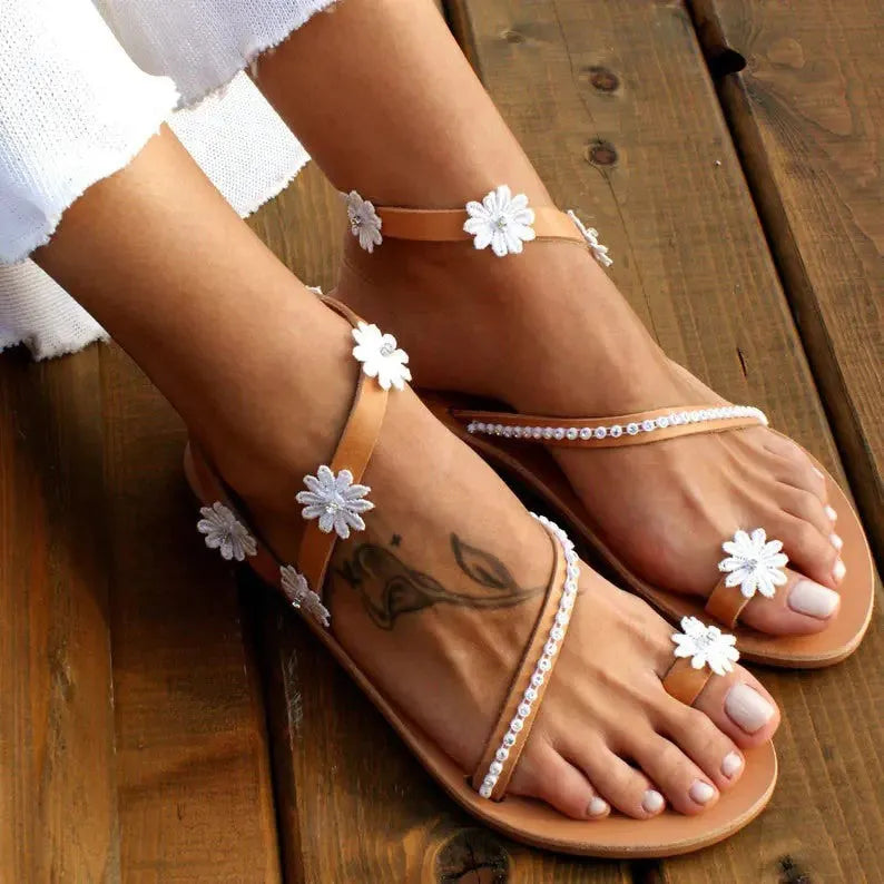 Brown women's Roman sandals with flower pattern and herringbone toe design