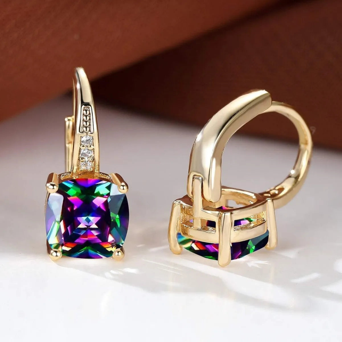 Square geometric moissanite ear clip in gold electroplated finish on copper.