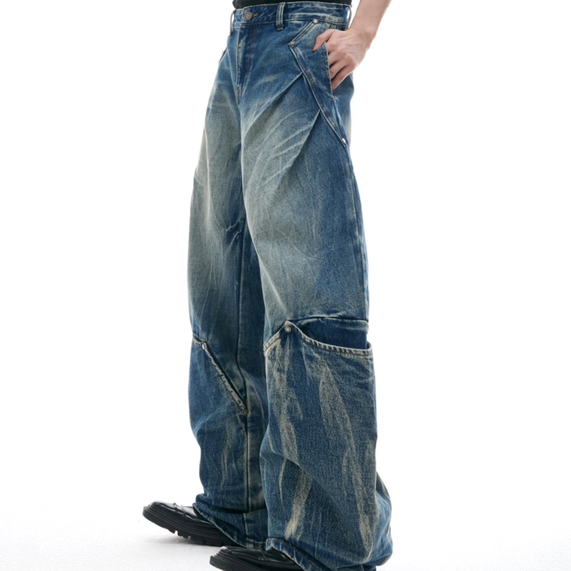 Men's verdant blue jeans with retro washed burst pattern and curved knife style loose fit design