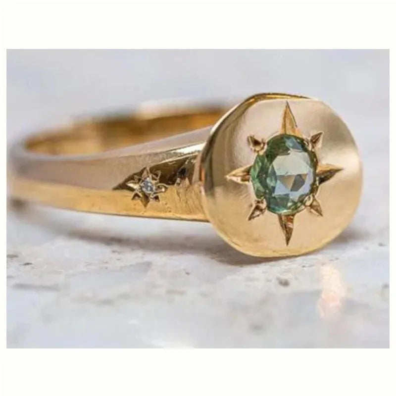 Golden adjustable ring with star design and oval asterism zircon setting