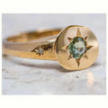 Golden adjustable ring with star design and oval asterism zircon setting