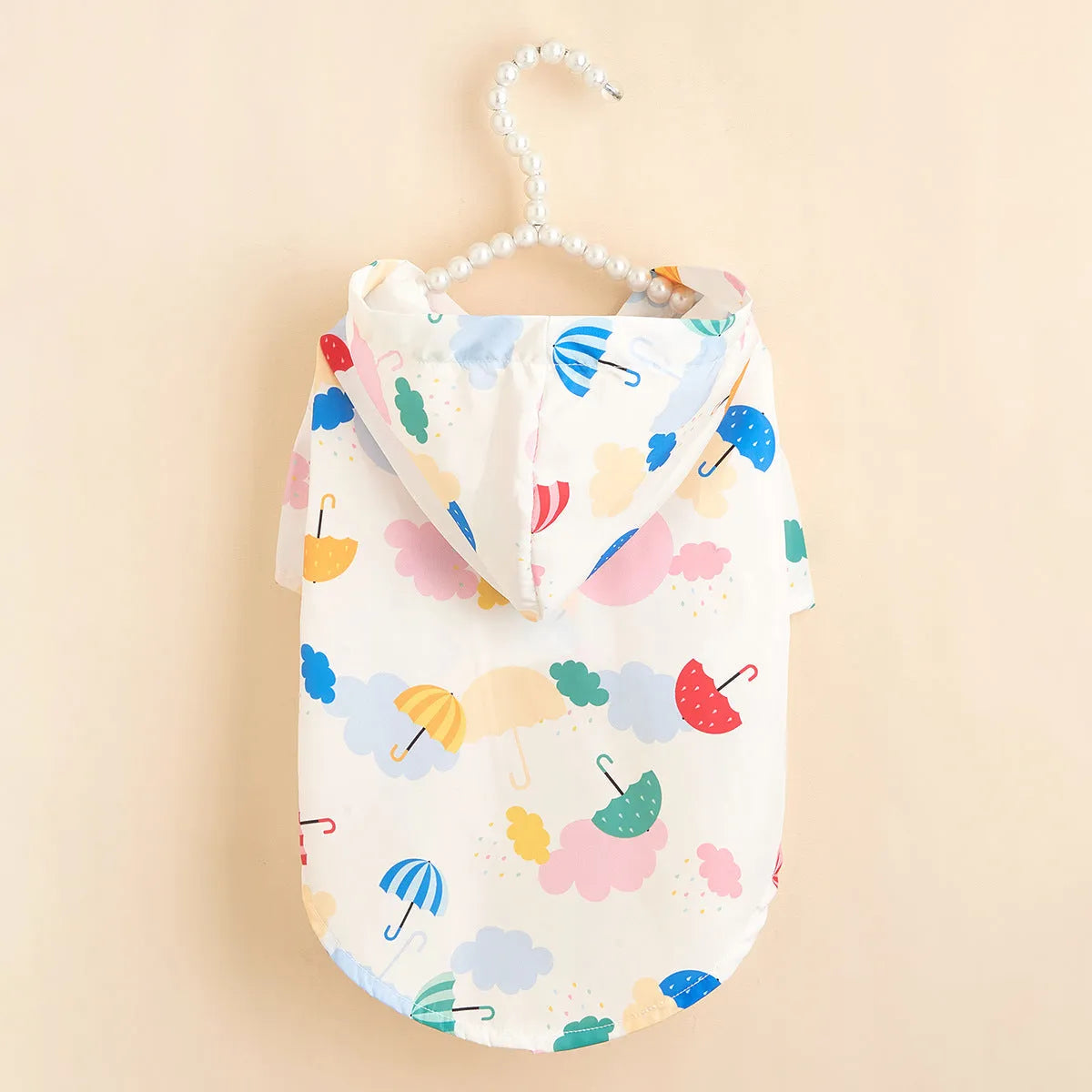 Colourful cartoon umbrella pattern dog raincoat or cat jacket in polyester.