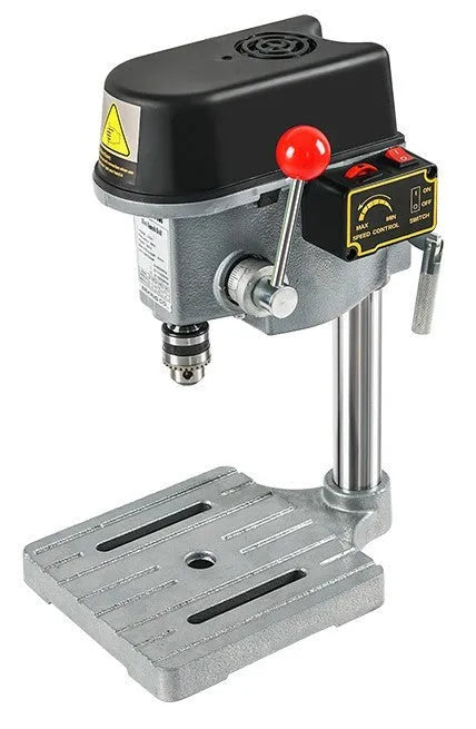 Bench-mounted drilling and milling machine with motor, chuck, and adjustable work table.