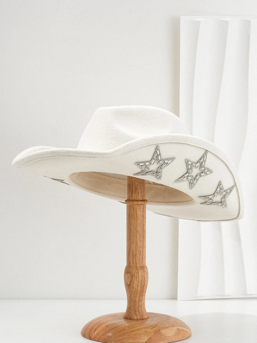 Brown polyester Western denim top hat with a conical crown and a silver hexagonal star decoration on the front.