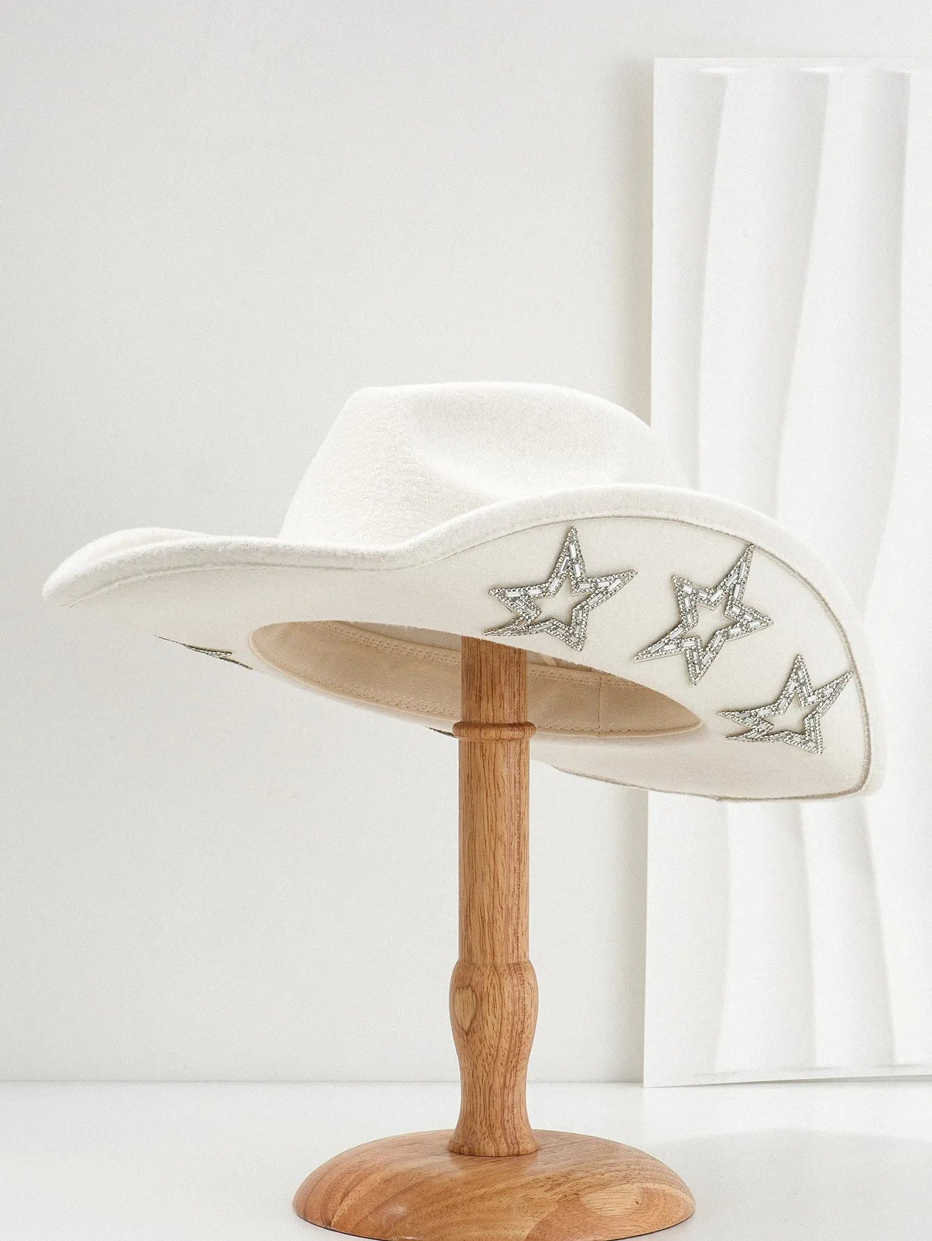 Brown polyester Western denim top hat with a conical crown and a silver hexagonal star decoration on the front.