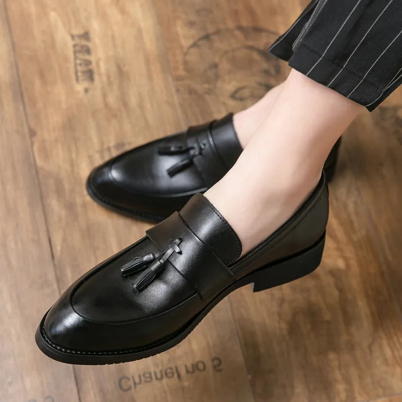 Men's black slip-on business casual leather shoes with tassel detail and rubber sole