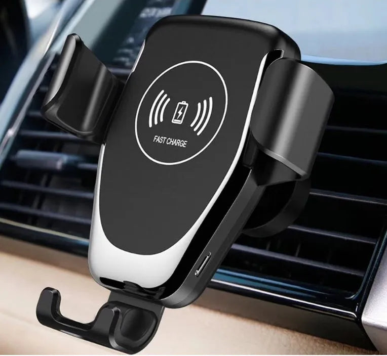 Black car wireless charger mounted on vent with iPhone secured by automatic clamping arms
