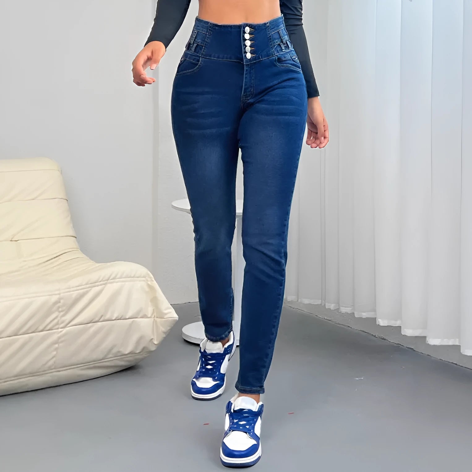 Dark blue women's straight-leg cotton denim jeans with button and zip front.