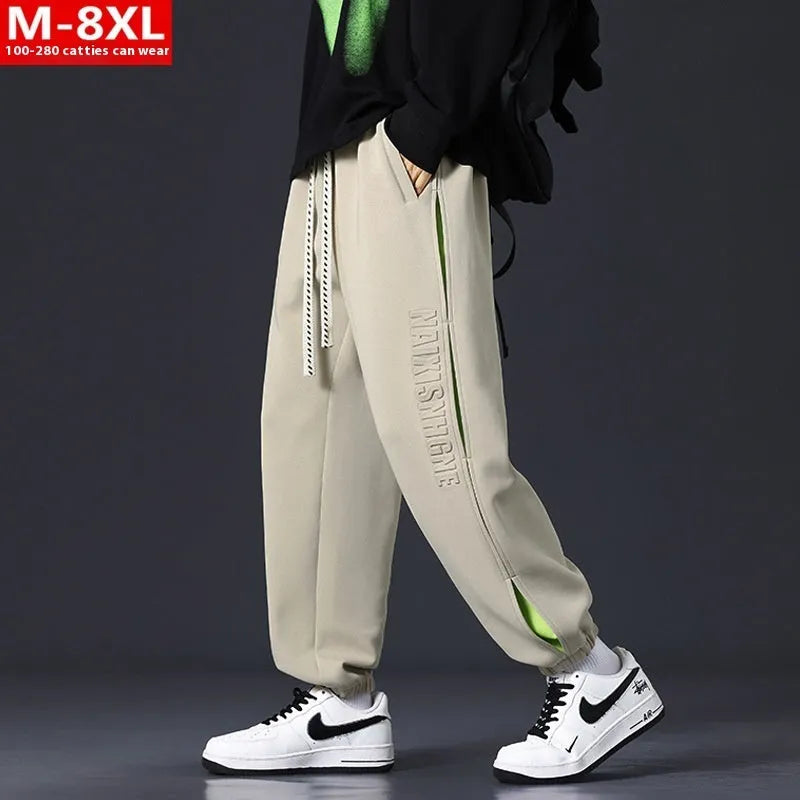 Men's black banded ankle cotton trousers with stitching detail and loose fit design