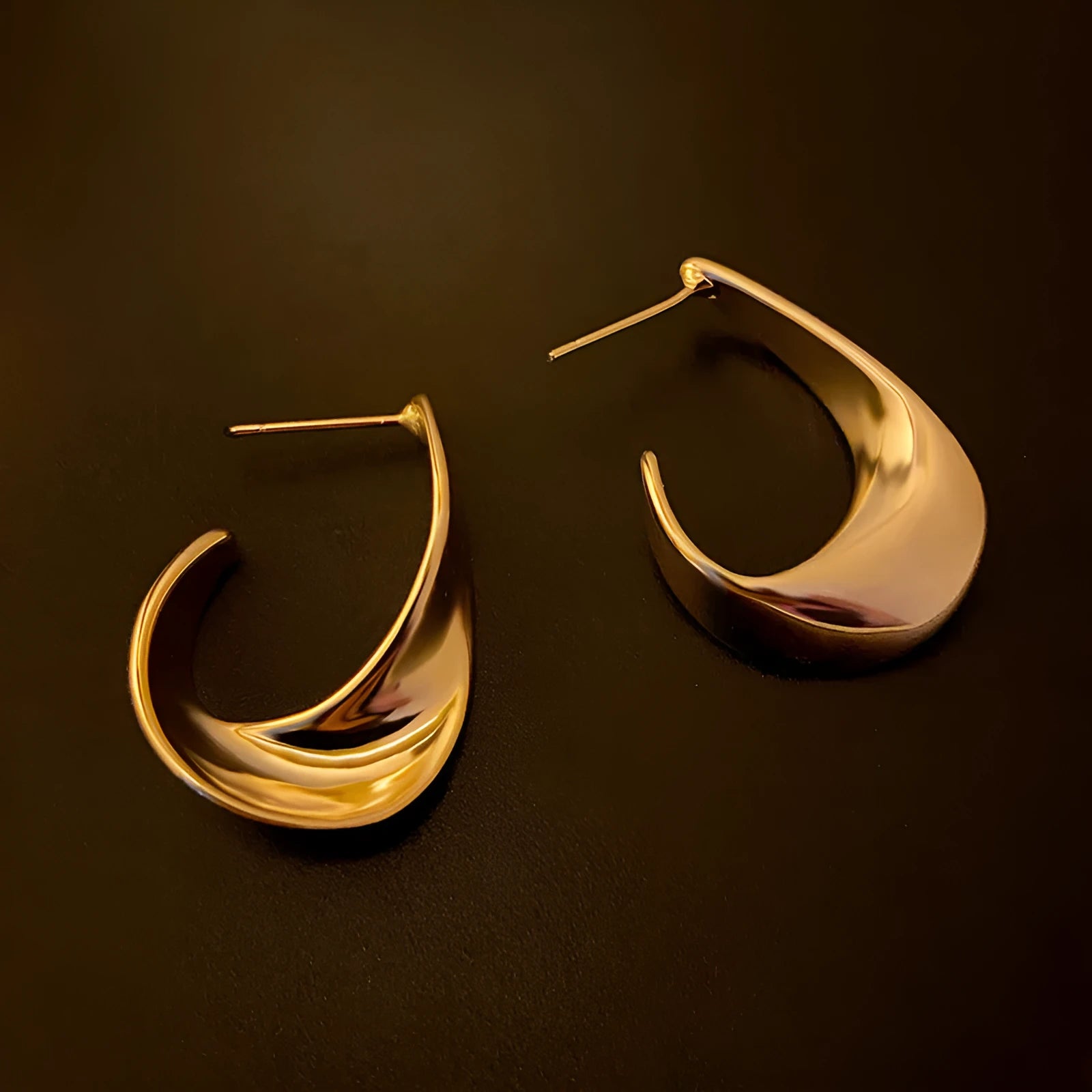 Twisted geometric metal earrings in gold and silver electroplated finishes