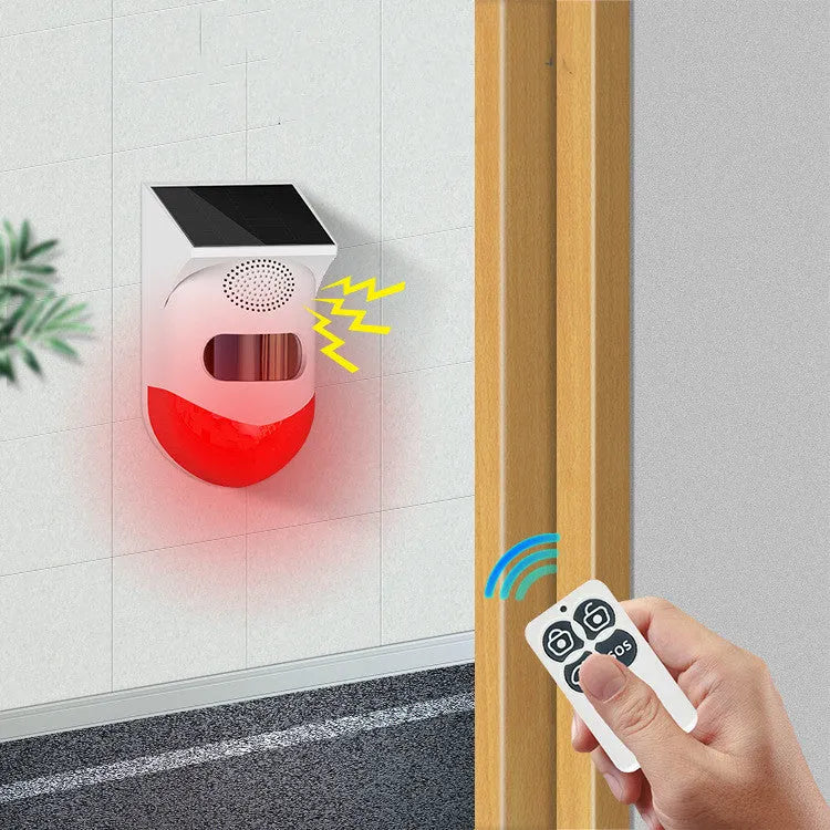 Solar-powered infrared security alarm with remote control for outdoor wall mounting