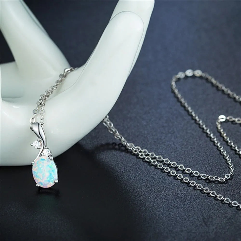 Water drop opal pendant on an adjustable alloy chain necklace in rose gold colour