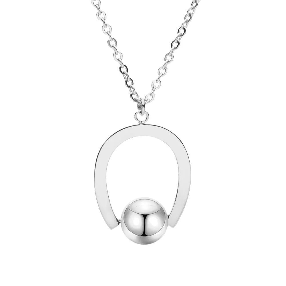 Adjustable stainless steel necklace with geometric pendant on a cross chain in gold finish.
