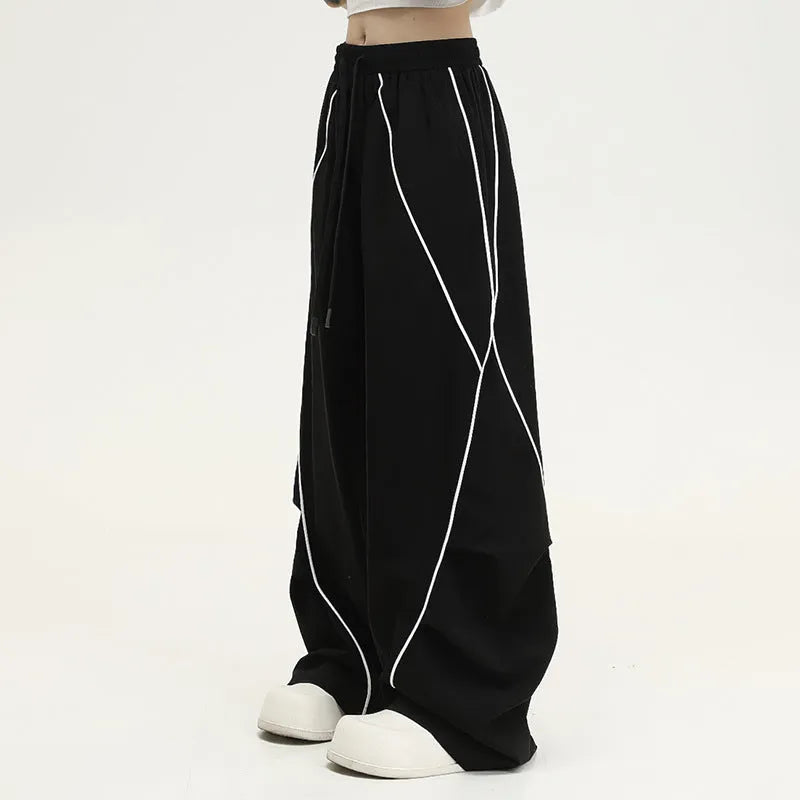 Black pleated wide-leg hip hop trousers with stripe pattern and mid waist cut