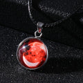 Luminous alloy necklace with a glass pendant depicting a Christmas moon night sky, showing the extension chain.