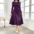 Purple women's long sleeve dress with round neck and ruffle detail on a mid waist.