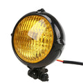 Black electroplated aluminium retro headlight with 8cm diameter and halogen bulb.