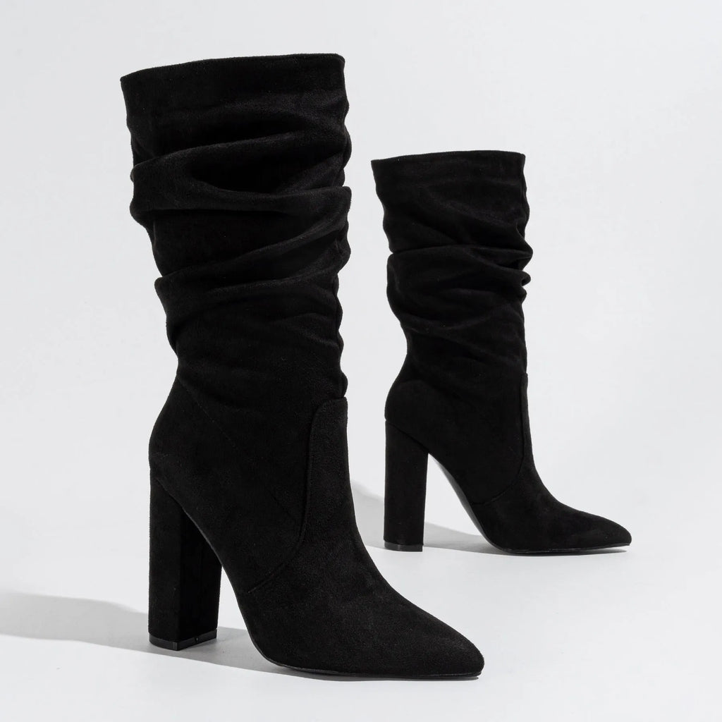 Women's black suede chunky heel boots with a pointed toe and middle-calf shaft.