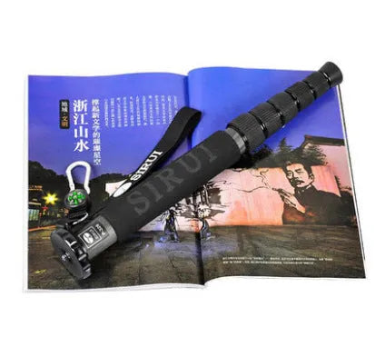 Black carbon fibre camera monopod extended to show six telescoping sections