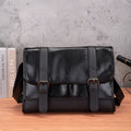 Black Korean-style anti-theft commuter backpack made from PU leather with contrast stitching