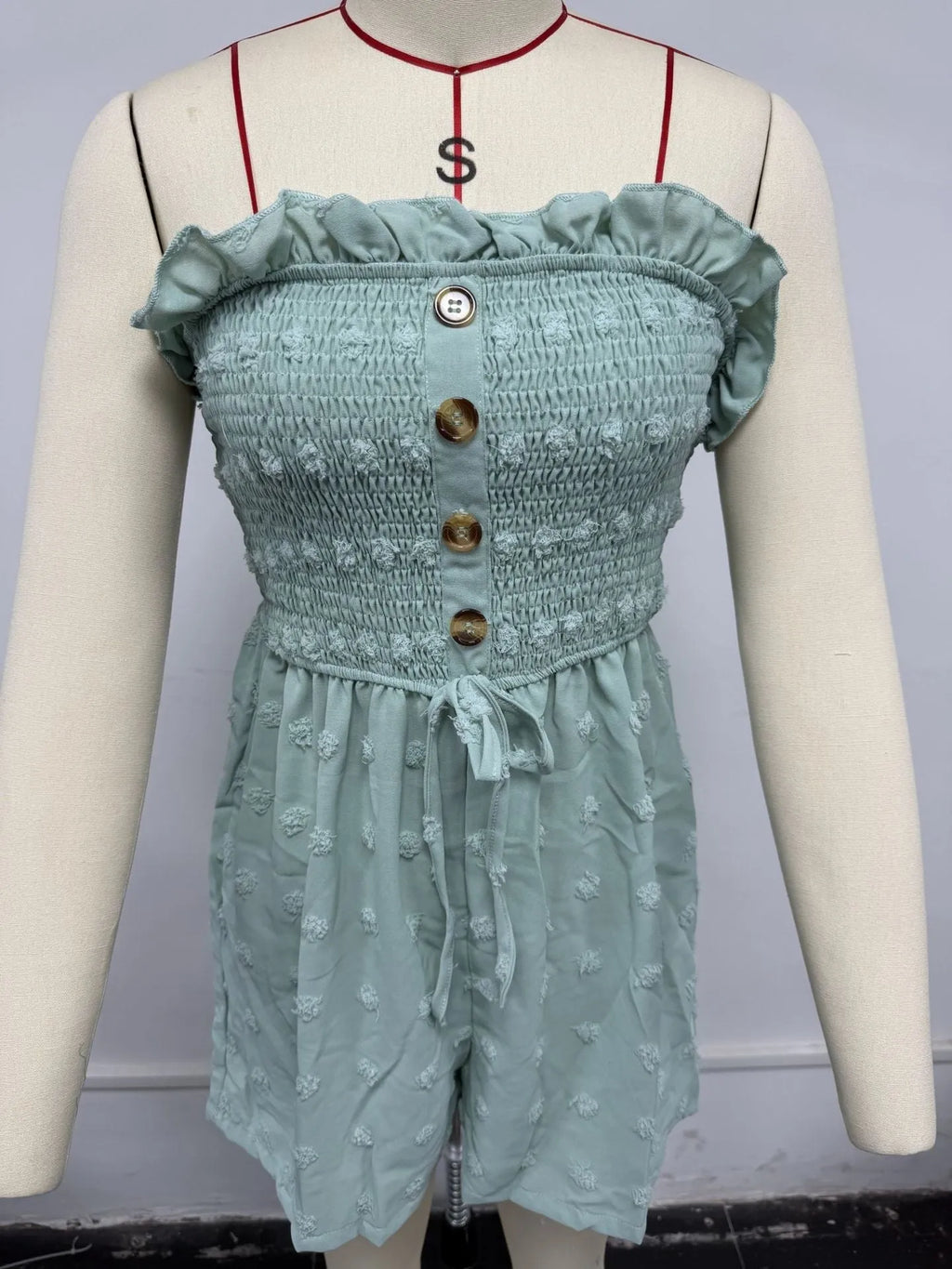 Women's solid colour off-shoulder sleeveless jumpsuit in a casual style on a hanger.