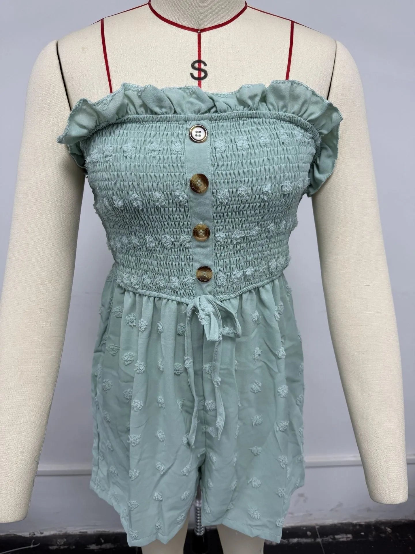 Women's solid colour off-shoulder sleeveless jumpsuit in a casual style on a hanger.