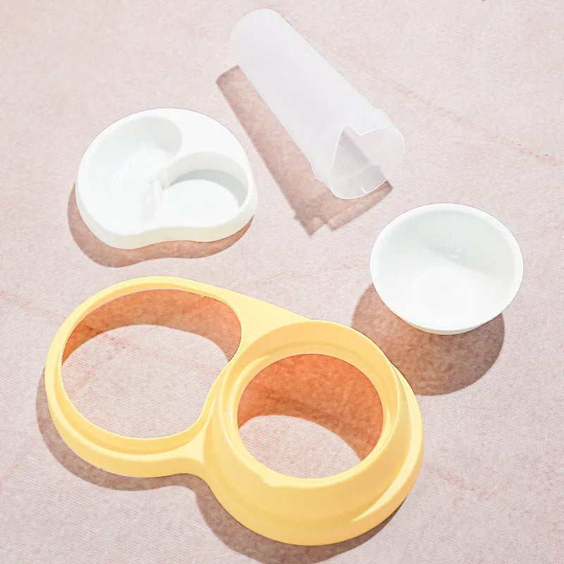 Grey and yellow dual-bowl pet feeder with stainless steel bowl for cats and dogs.