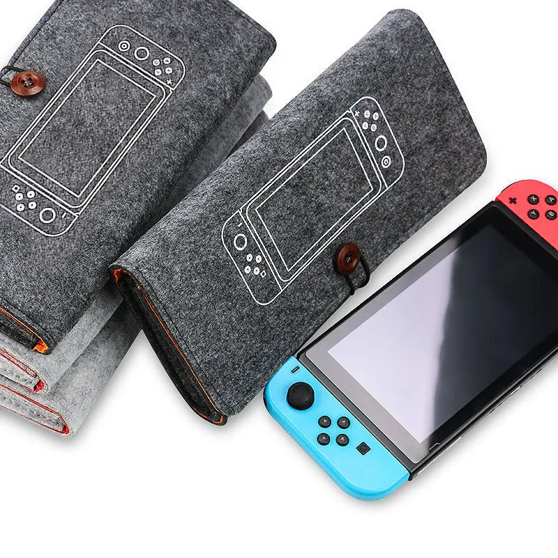 Black Nintendo Switch soft felt carrying pouch case showing game cartridge slots and double storage layers.