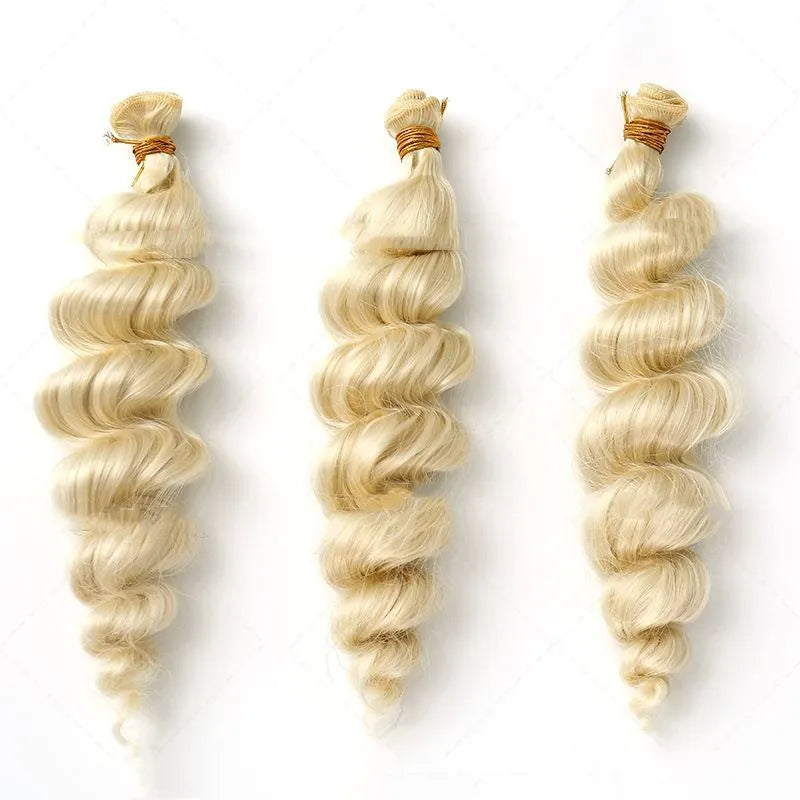 Golden synthetic wig on a stand showing long, straight high-temperature chemical fibre weft.