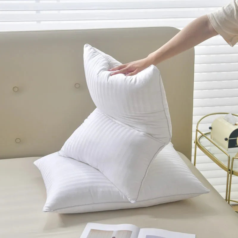 White cotton satin stripe pillow with feather cotton filler, shown in low, medium, and high loft options.