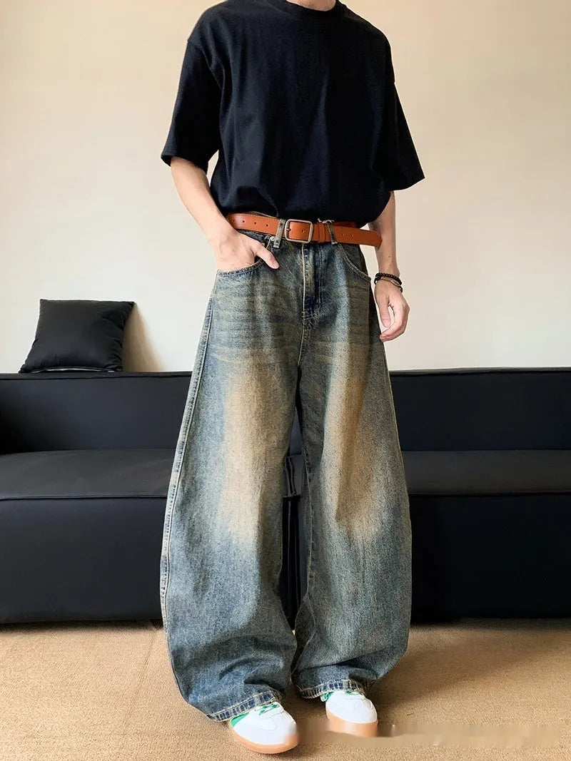 Men's retro blue distressed denim jeans with slim wide-leg fit showing micro elasticity fabric