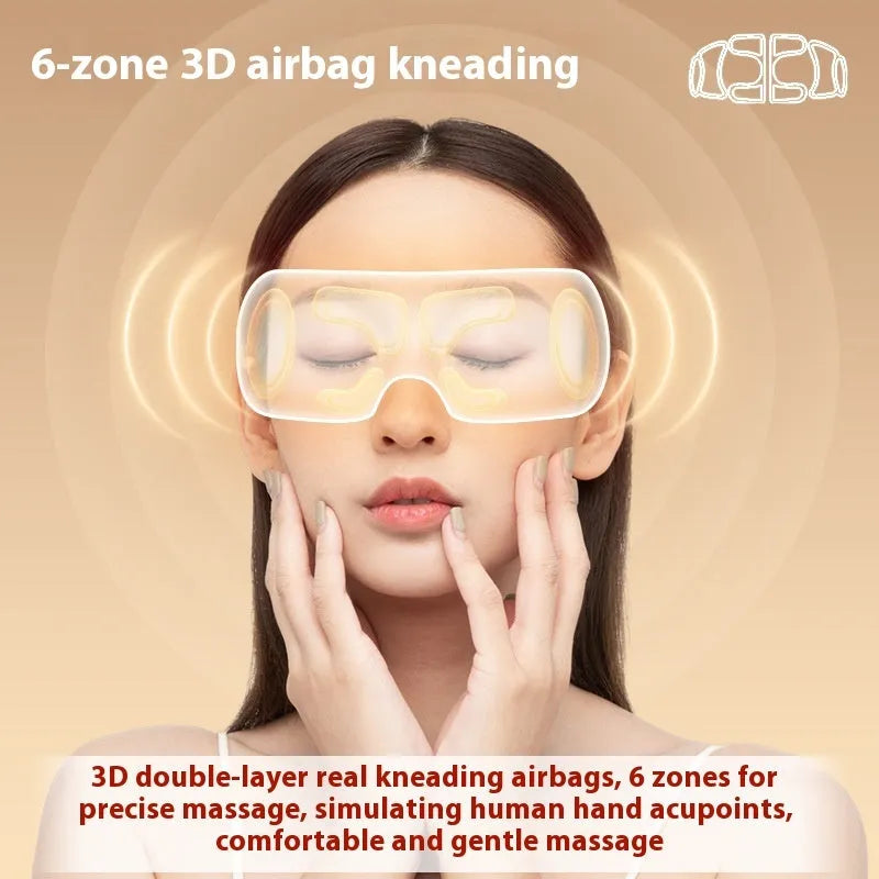 White rechargeable eye massager with airbag massage and hot compress function on a table.