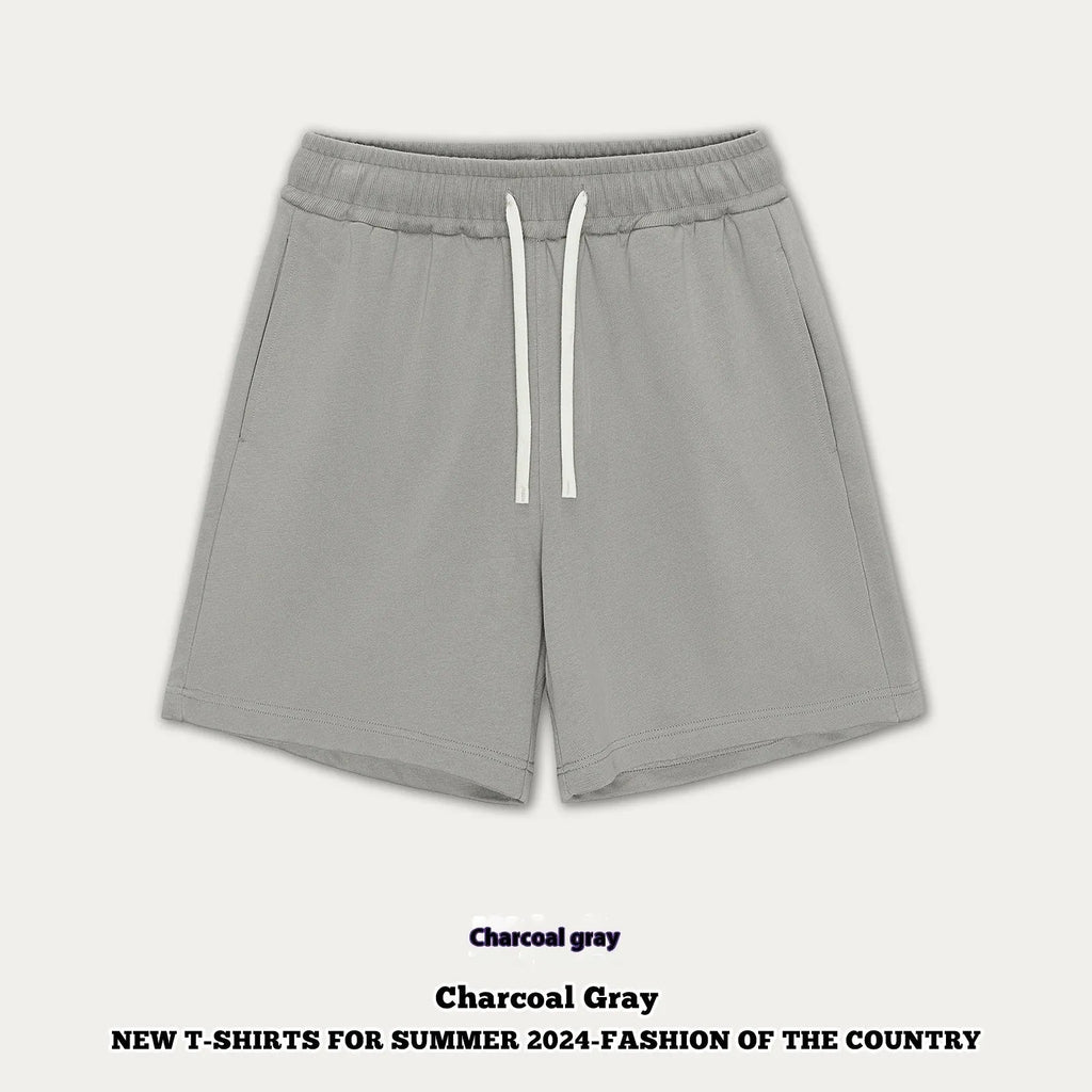 A pair of loose-fit cotton denim shorts for children in a charcoal gray colour