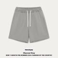 A pair of loose-fit cotton denim shorts for children in a charcoal gray colour