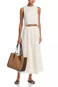 White women's retro style suit with sleeveless top, long skirt and embroidery detailing