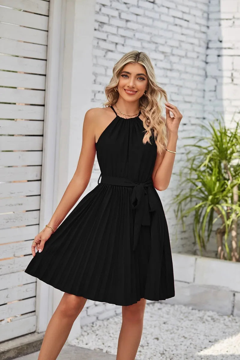 Women's black chiffon halter dress with pleated midi skirt and adjustable waist belt.