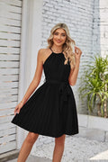 Women's black chiffon halter dress with pleated midi skirt and adjustable waist belt.