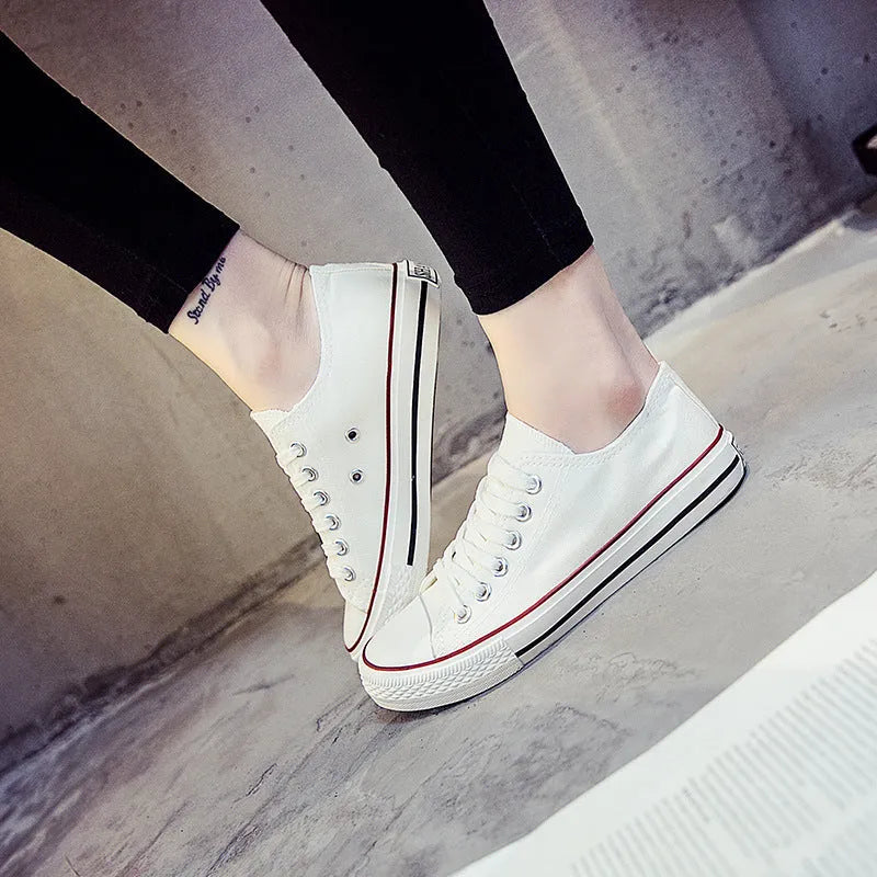 Women's casual canvas shoes in solid colours showing black, white black, white red, and all black options