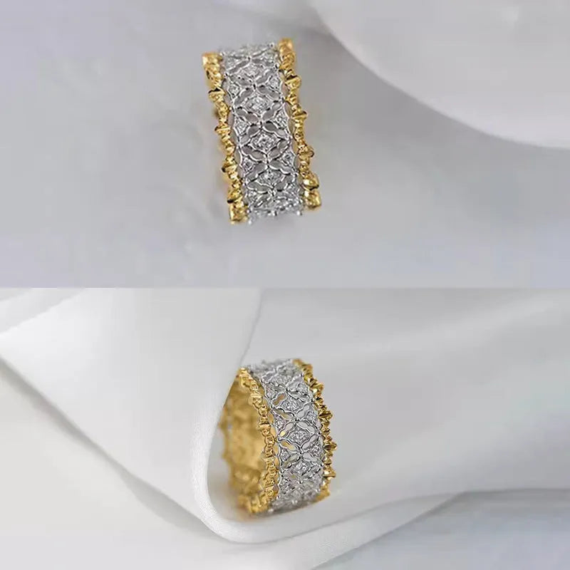 Geometric two-tone gold ring with a round zircon centre on a copper band.