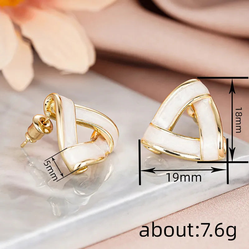 Women's metal oil stud earrings in yellow gold with inlaid zircon and triangle shape