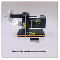 Alloy steel watch strap stripping machine tool set for watch repair on a workbench.