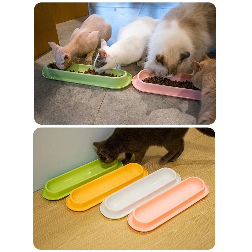 Green, pink and yellow leakproof pet food and water bowls for dogs and cats.