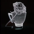 3D rose-shaped LED night light showing colour-changing glow on acrylic panel with ABS base.