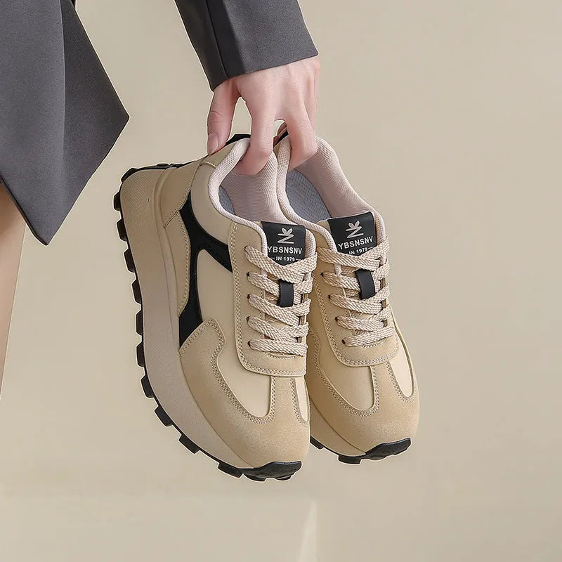 Women's solid colour platform sports shoes with lace-up front and flat rubber sole.