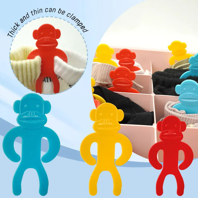 Blue, yellow, and red plastic socks storage clips for washing machine organisation.