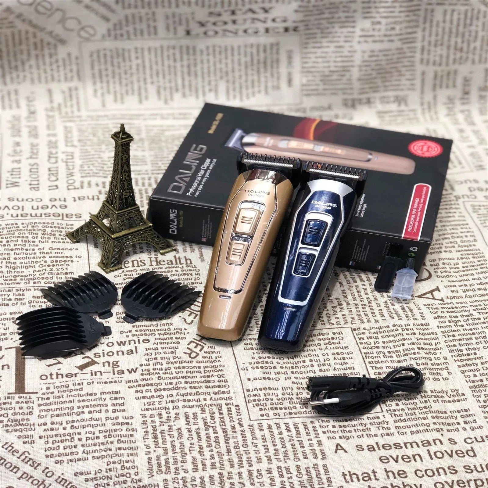 Rechargeable dark blue electric hair clipper with stainless steel blades on a white background.