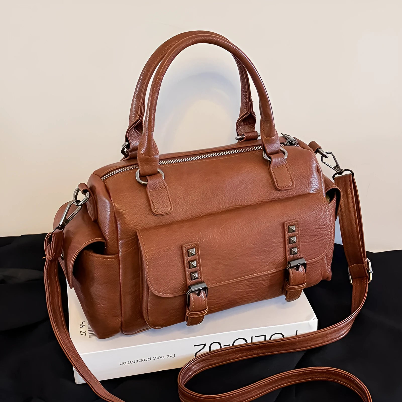 Large capacity vintage messenger bag in horizontal square shape, shown in available colours: blue, gray, camel, red, black, brown.