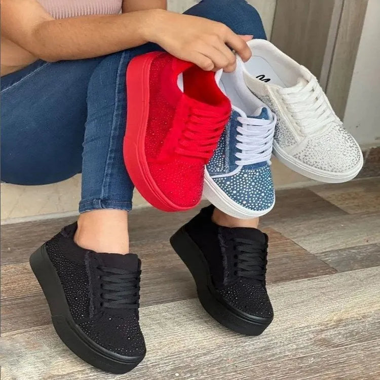 Plus size women's black lace-up casual shoes with rhinestone detail on the round toe and a thick rubber sole.