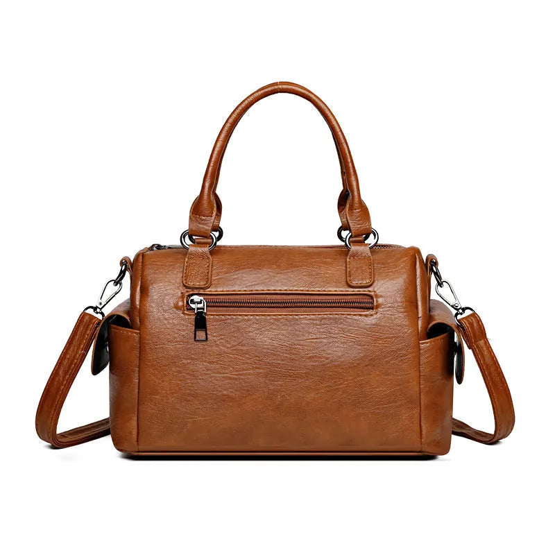 Large capacity vintage messenger bag in horizontal square shape, shown in available colours: blue, gray, camel, red, black, brown.