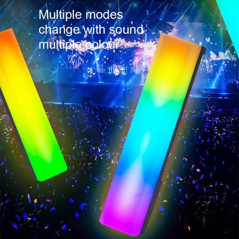 Black and white 3D RGB music rhythm ambiance lamp on a table with USB cable.